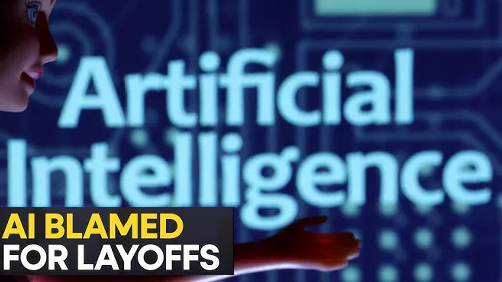 Robot and human hands working together at a computer terminal representing AI in the workplace