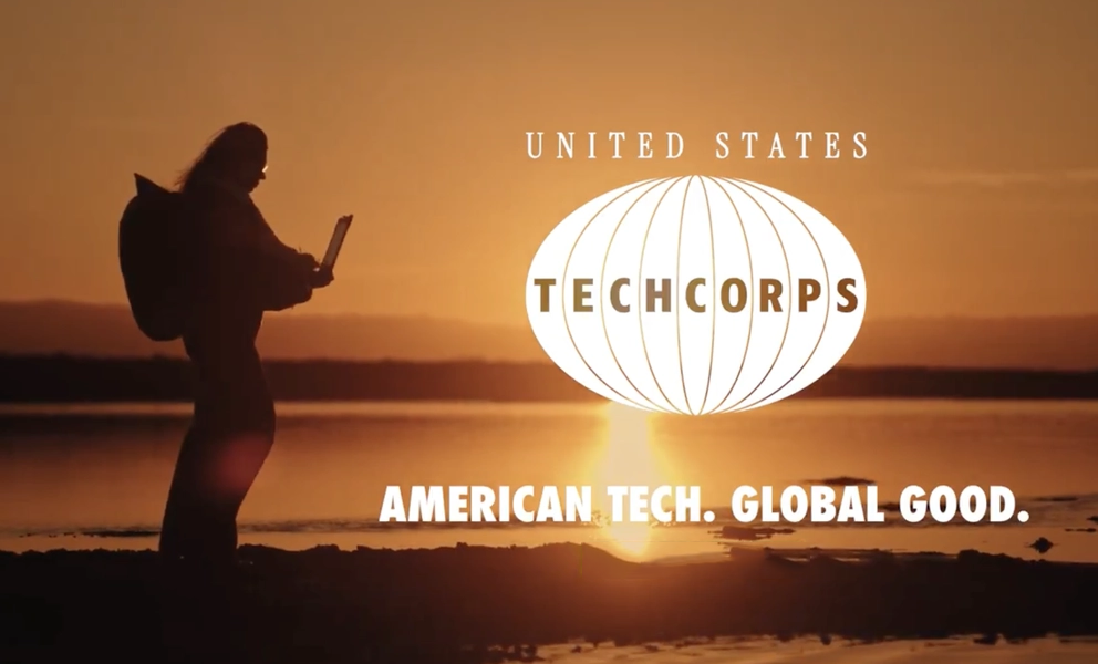 Technology volunteers with laptop computers in international setting representing AI diplomacy